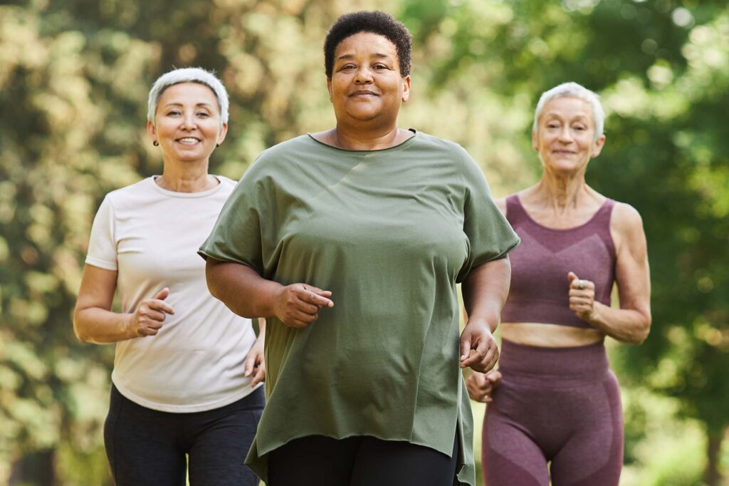 Three women with different dosha and body types walking outside